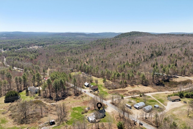 drone / aerial view featuring a view of trees