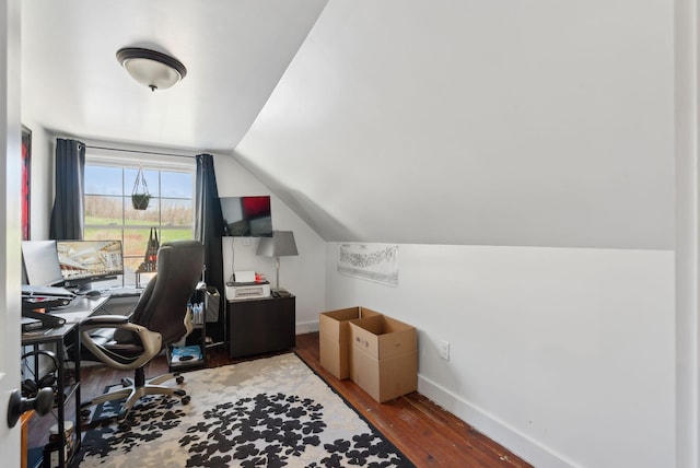 office area with baseboards, wood-type flooring, and vaulted ceiling