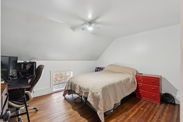 bedroom with wood-type flooring, a ceiling fan, and vaulted ceiling
