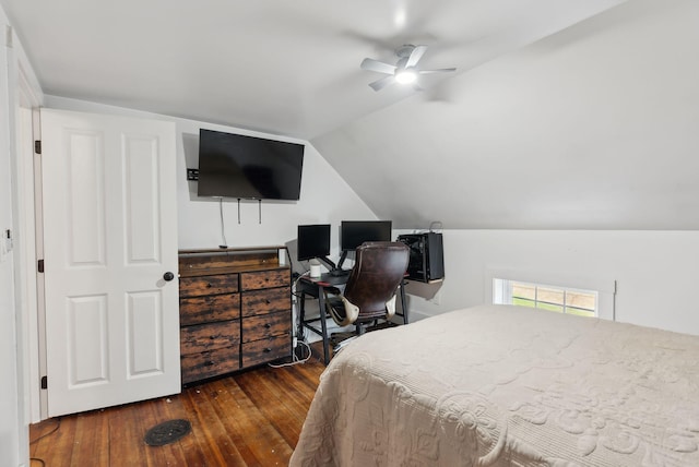 bedroom with ceiling fan, vaulted ceiling, and hardwood / wood-style flooring
