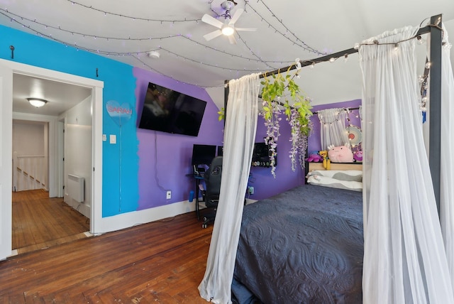 bedroom featuring wood-type flooring and baseboards