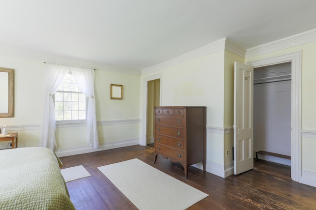 bedroom featuring hardwood / wood-style floors, baseboards, and ornamental molding