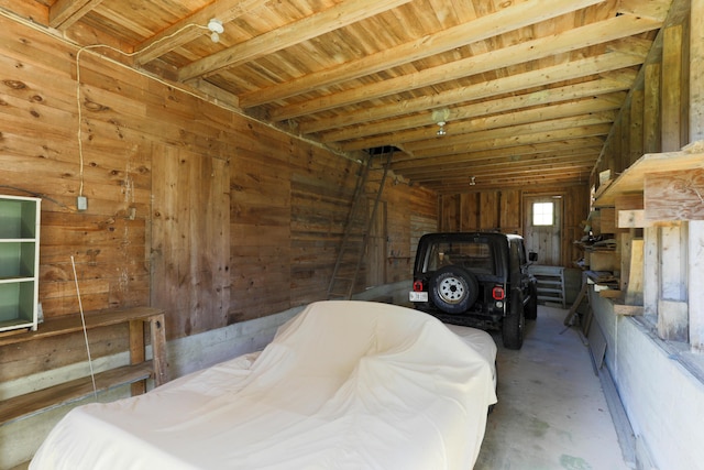 garage featuring wooden walls