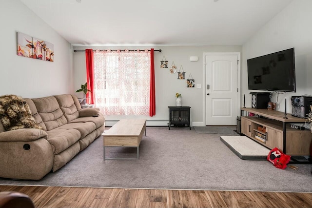80 Dixon Rd, Lebanon, ME 04027 - living area with wood finished floors and a baseboard heating unit