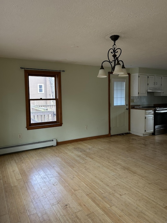 669 New Dam Rd, Waterboro, ME 04061 - interior space with light wood-type flooring, baseboard heating, a textured ceiling, and baseboards