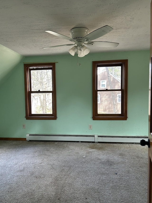 669 New Dam Rd, Waterboro, ME 04061 - carpeted spare room featuring plenty of natural light, a textured ceiling, baseboards, and a ceiling fan