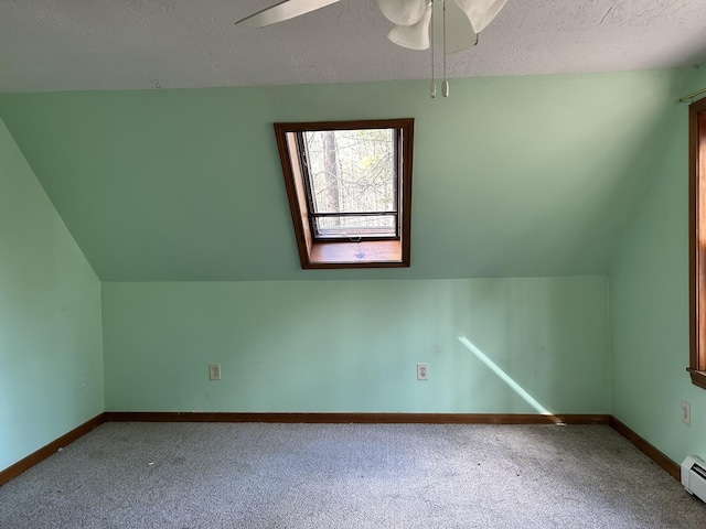669 New Dam Rd, Waterboro, ME 04061 - additional living space featuring a baseboard radiator, ceiling fan, a textured ceiling, and carpet floors