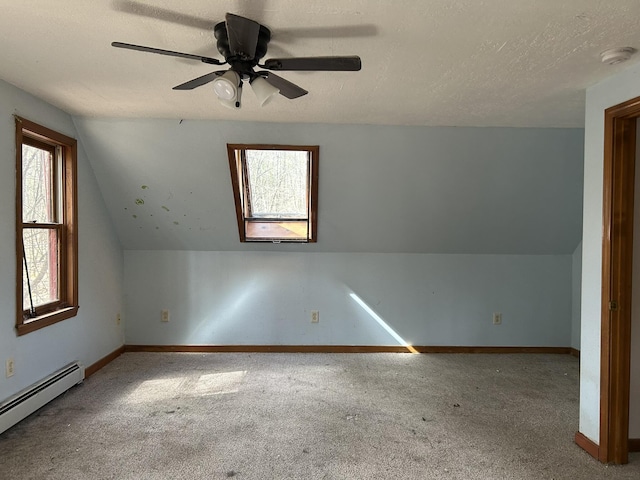 669 New Dam Rd, Waterboro, ME 04061 - additional living space with a baseboard radiator, carpet flooring, ceiling fan, and baseboards