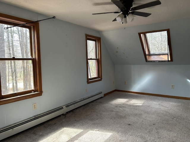 669 New Dam Rd, Waterboro, ME 04061 - bonus room featuring baseboards, ceiling fan, carpet, a baseboard heating unit, and lofted ceiling