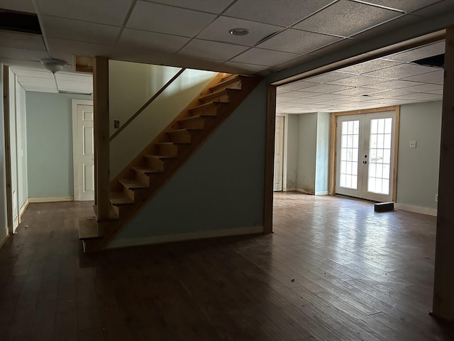 669 New Dam Rd, Waterboro, ME 04061 - below grade area featuring dark wood-style flooring, baseboards, a drop ceiling, and stairs