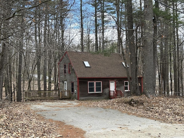 669 New Dam Rd, Waterboro, ME 04061 - chalet / cabin with a deck, driveway, and roof with shingles