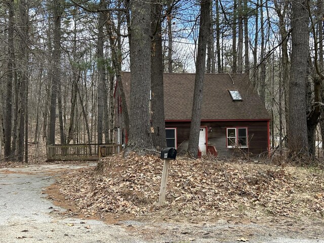 669 New Dam Rd, Waterboro, ME 04061 - view of side of home with a shingled roof