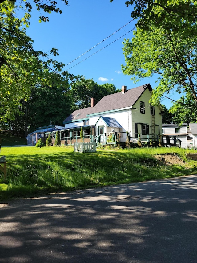 view of front of property featuring a chimney