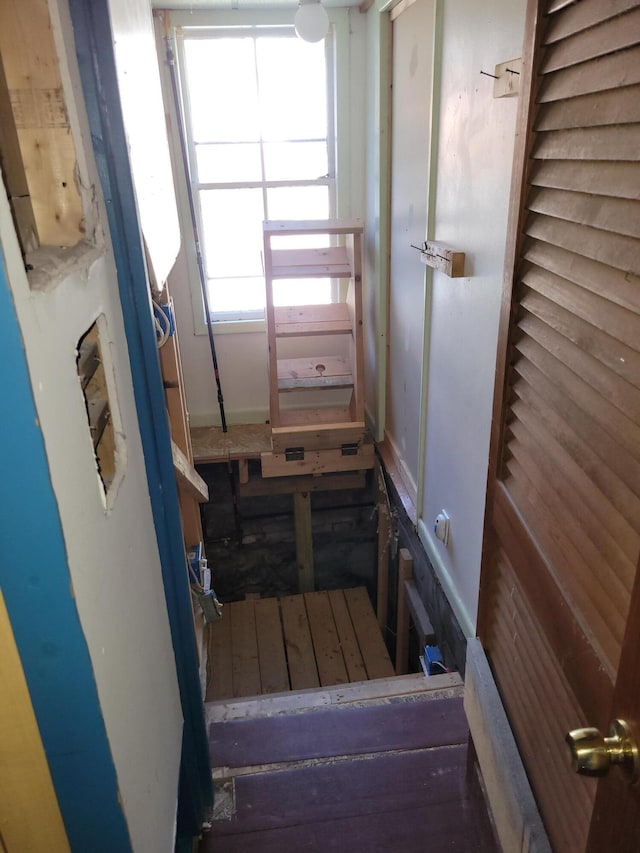 stairway featuring baseboards