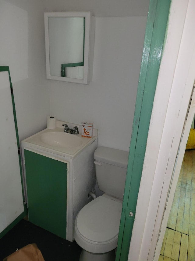 half bath with vanity and toilet