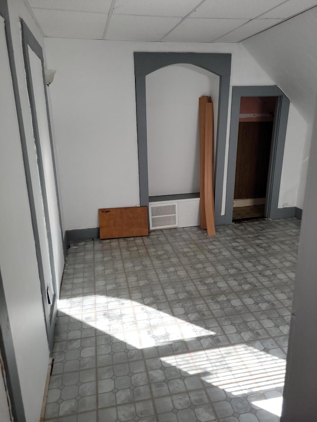 spare room with a paneled ceiling and visible vents