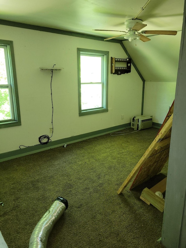 additional living space with lofted ceiling, baseboards, carpet floors, and ceiling fan