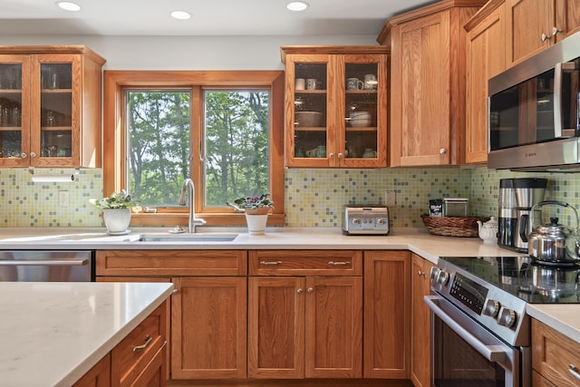 86 Firth Dr, Boothbay, ME 04537 - kitchen featuring stainless steel appliances, a sink, light countertops, tasteful backsplash, and recessed lighting