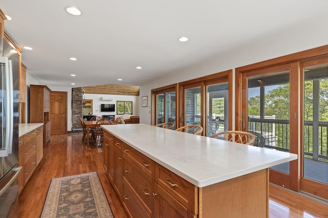 86 Firth Dr, Boothbay, ME 04537 - kitchen featuring dark wood-type flooring, light countertops, recessed lighting, a kitchen island, and brown cabinetry