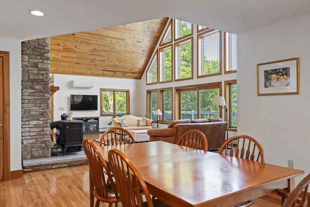 86 Firth Dr, Boothbay, ME 04537 - dining area featuring a wood stove, high vaulted ceiling, light wood-style floors, wood ceiling, and recessed lighting