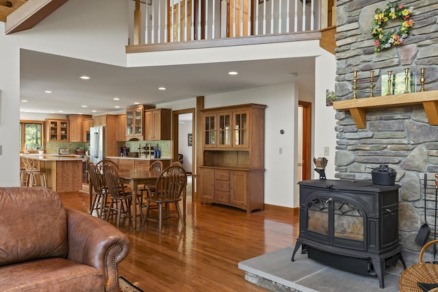 86 Firth Dr, Boothbay, ME 04537 - dining area with wood finished floors, a wood stove, and recessed lighting