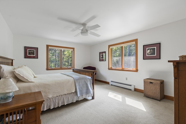 86 Firth Dr, Boothbay, ME 04537 - bedroom with baseboard heating, light colored carpet, baseboards, and ceiling fan