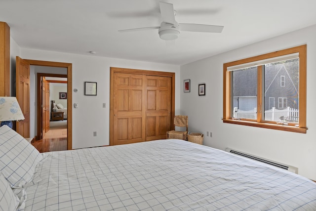 86 Firth Dr, Boothbay, ME 04537 - bedroom featuring a baseboard heating unit, a closet, and a ceiling fan