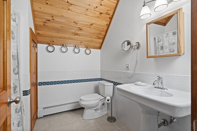 86 Firth Dr, Boothbay, ME 04537 - full bath with a baseboard heating unit, tile walls, wooden ceiling, tile patterned flooring, and toilet