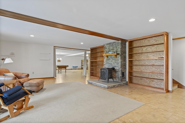86 Firth Dr, Boothbay, ME 04537 - living room with recessed lighting, a wood stove, baseboards, and built in shelves