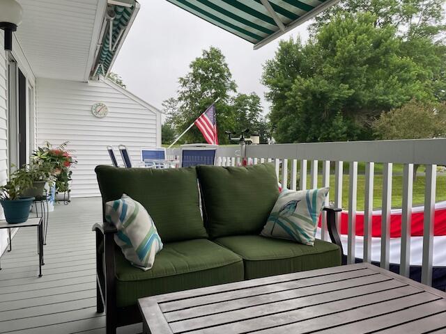 24 Clifford Rd Unit 18, Naples, ME 04055 - wooden deck with an outdoor living space