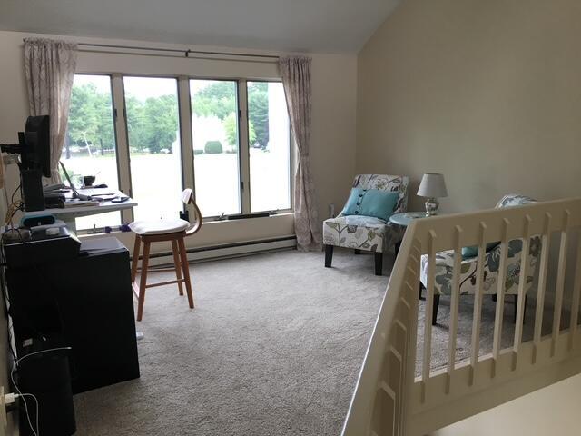 24 Clifford Rd Unit 18, Naples, ME 04055 - interior space with baseboard heating and a wealth of natural light