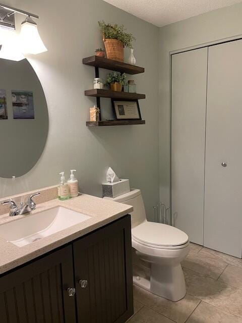 24 Clifford Rd Unit 18, Naples, ME 04055 - half bath with vanity, a textured ceiling, and toilet
