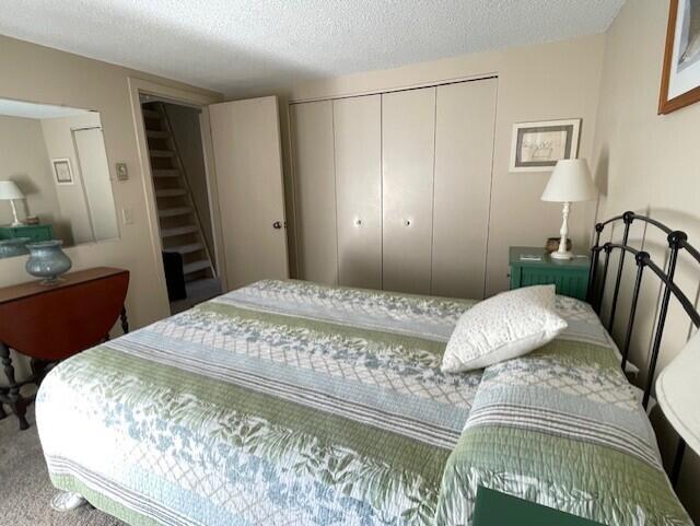 24 Clifford Rd Unit 18, Naples, ME 04055 - bedroom with carpet floors, a closet, and a textured ceiling