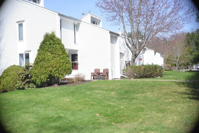 24 Clifford Rd Unit 18, Naples, ME 04055 - rear view of house featuring a yard