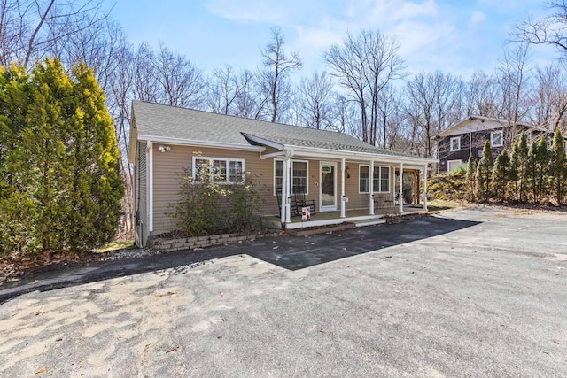 214 Gore Rd, Naples, ME 04055 - back of house with a porch and a shingled roof