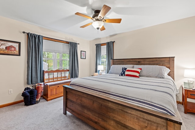 214 Gore Rd, Naples, ME 04055 - bedroom featuring light carpet, baseboards, and ceiling fan