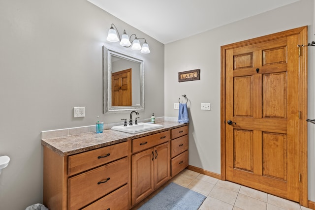 214 Gore Rd, Naples, ME 04055 - bathroom with vanity, tile patterned floors, and baseboards