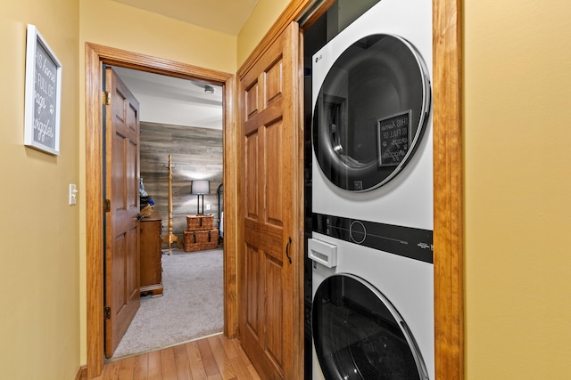 214 Gore Rd, Naples, ME 04055 - washroom with stacked washer / dryer and light wood-type flooring
