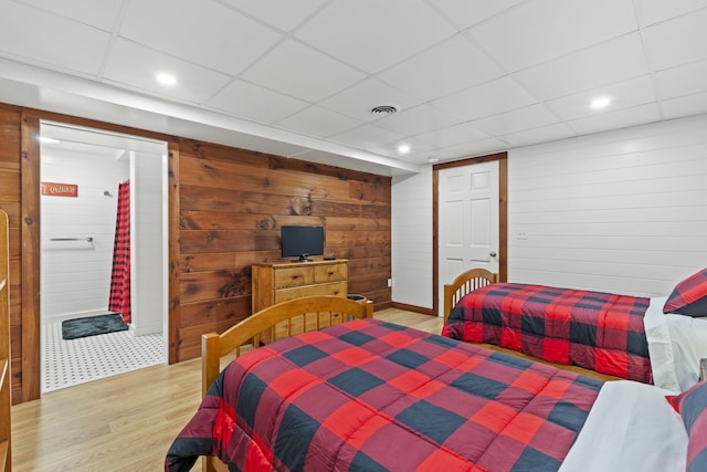 214 Gore Rd, Naples, ME 04055 - bedroom with light wood-style floors, wooden walls, a paneled ceiling, and recessed lighting