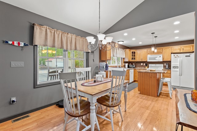 214 Gore Rd, Naples, ME 04055 - dining space featuring lofted ceiling, light wood-style floors, a chandelier, and recessed lighting
