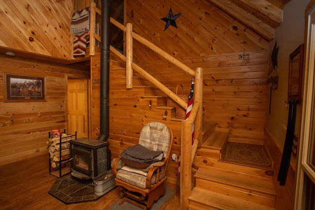 200 Averill Hill Rd, Dixfield, ME 04224 - stairway with wooden walls, wood ceiling, lofted ceiling, a wood stove, and wood finished floors