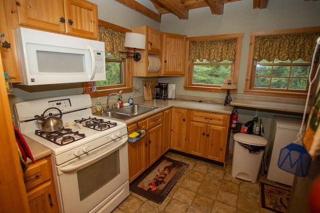 200 Averill Hill Rd, Dixfield, ME 04224 - kitchen featuring white appliances, a sink, light countertops, beamed ceiling, and light stone finish flooring
