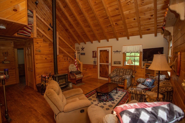 200 Averill Hill Rd, Dixfield, ME 04224 - living area with wood walls, wooden ceiling with exposed beams, wood finished floors, a wood stove, and high vaulted ceiling