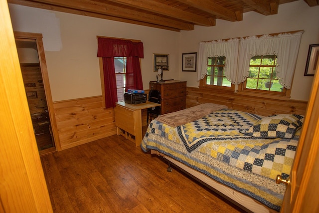 200 Averill Hill Rd, Dixfield, ME 04224 - bedroom featuring wood finished floors, a wainscoted wall, wooden walls, and wooden ceiling with exposed beams