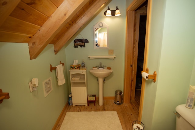 200 Averill Hill Rd, Dixfield, ME 04224 - bathroom with wood finished floors, toilet, and a sink