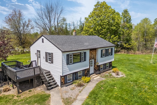 269 Hebron Rd, Buckfield, ME 04220 - raised ranch with a shingled roof, a front lawn, a wooden deck, and entry steps