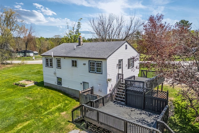 269 Hebron Rd, Buckfield, ME 04220 - back of house featuring a deck, roof with shingles, a yard, and a chimney
