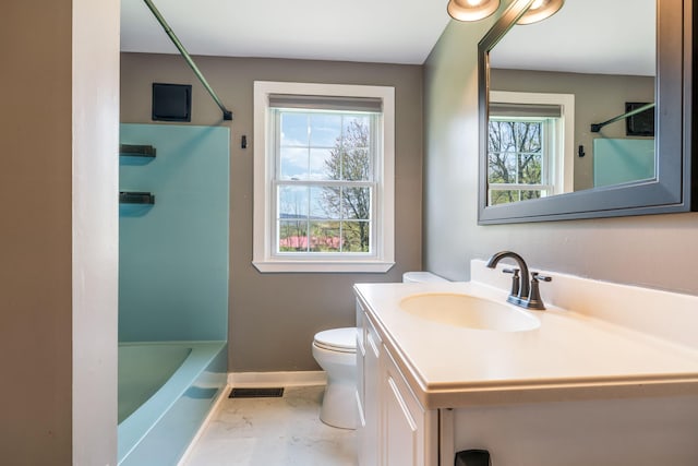 269 Hebron Rd, Buckfield, ME 04220 - bathroom featuring healthy amount of natural light, baseboards, vanity, and toilet