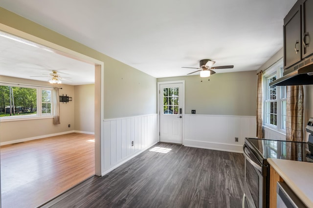 269 Hebron Rd, Buckfield, ME 04220 - unfurnished living room with ceiling fan, wainscoting, and dark wood-style flooring