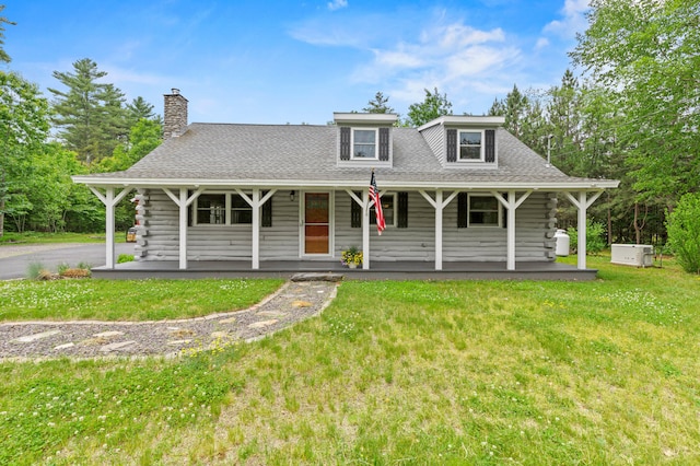 60 Line Rd, Buxton, ME 04093 - view of front of home with a porch, a front lawn, and a shingled roof